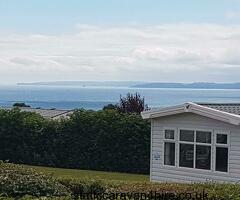 2 bed mini lodge with large decking, parking and seaviews on Sunset View area of Haven Devon Cliffs